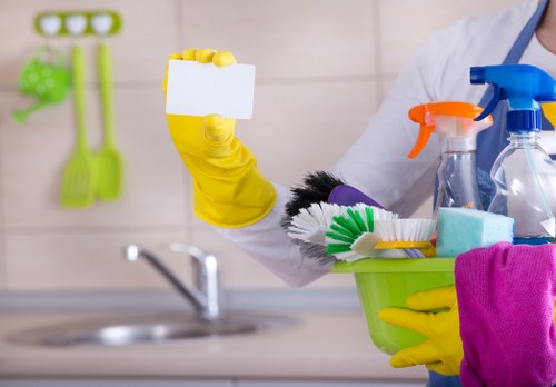 Carpet cleaning technician working safely in a Friern Barnet home