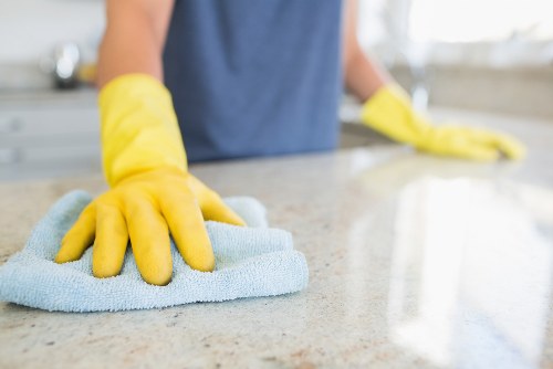 Local carpet cleaner treating a stubborn carpet stain in a Friern Barnet home